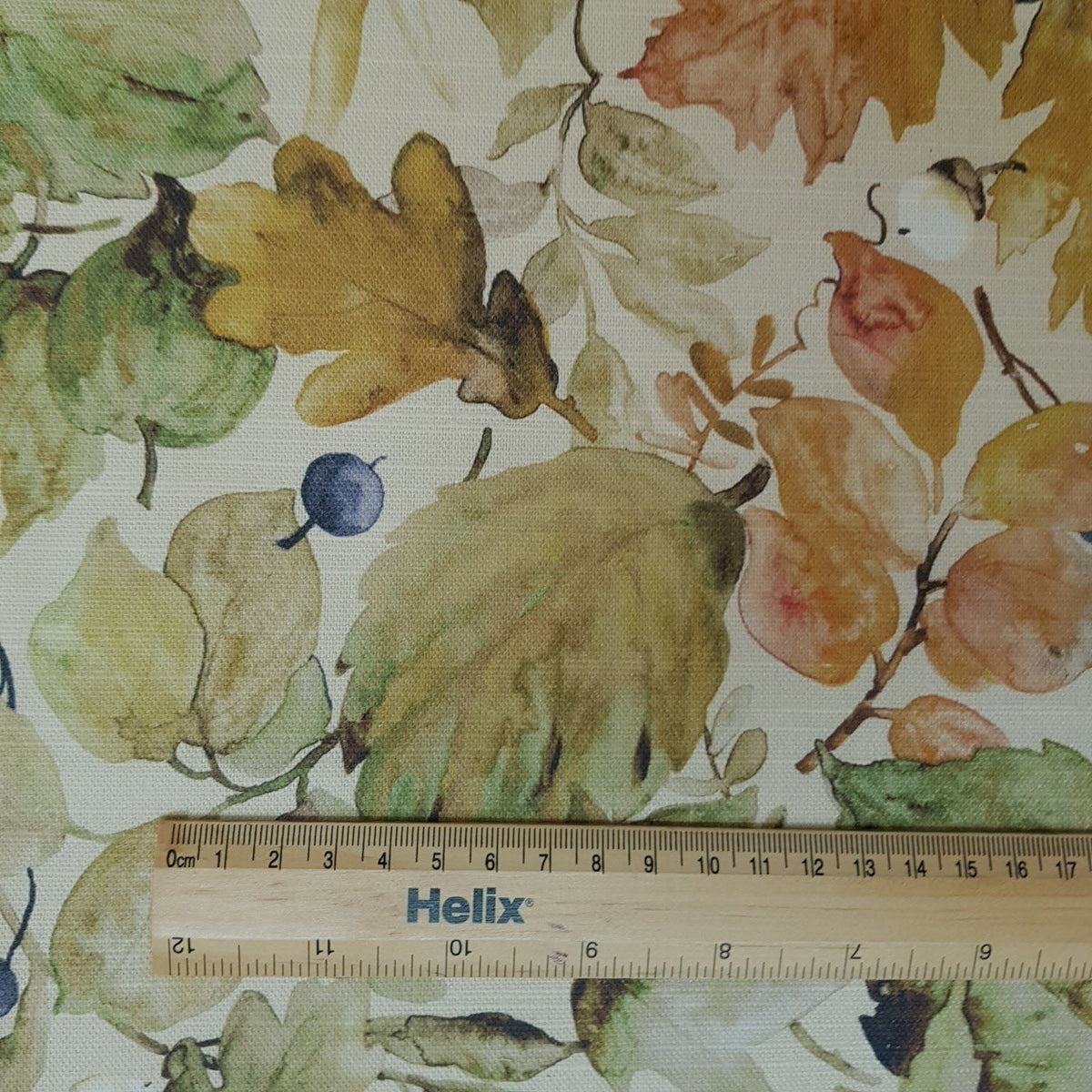 Curtain fabric with a rule showing scale of autumn leaves design