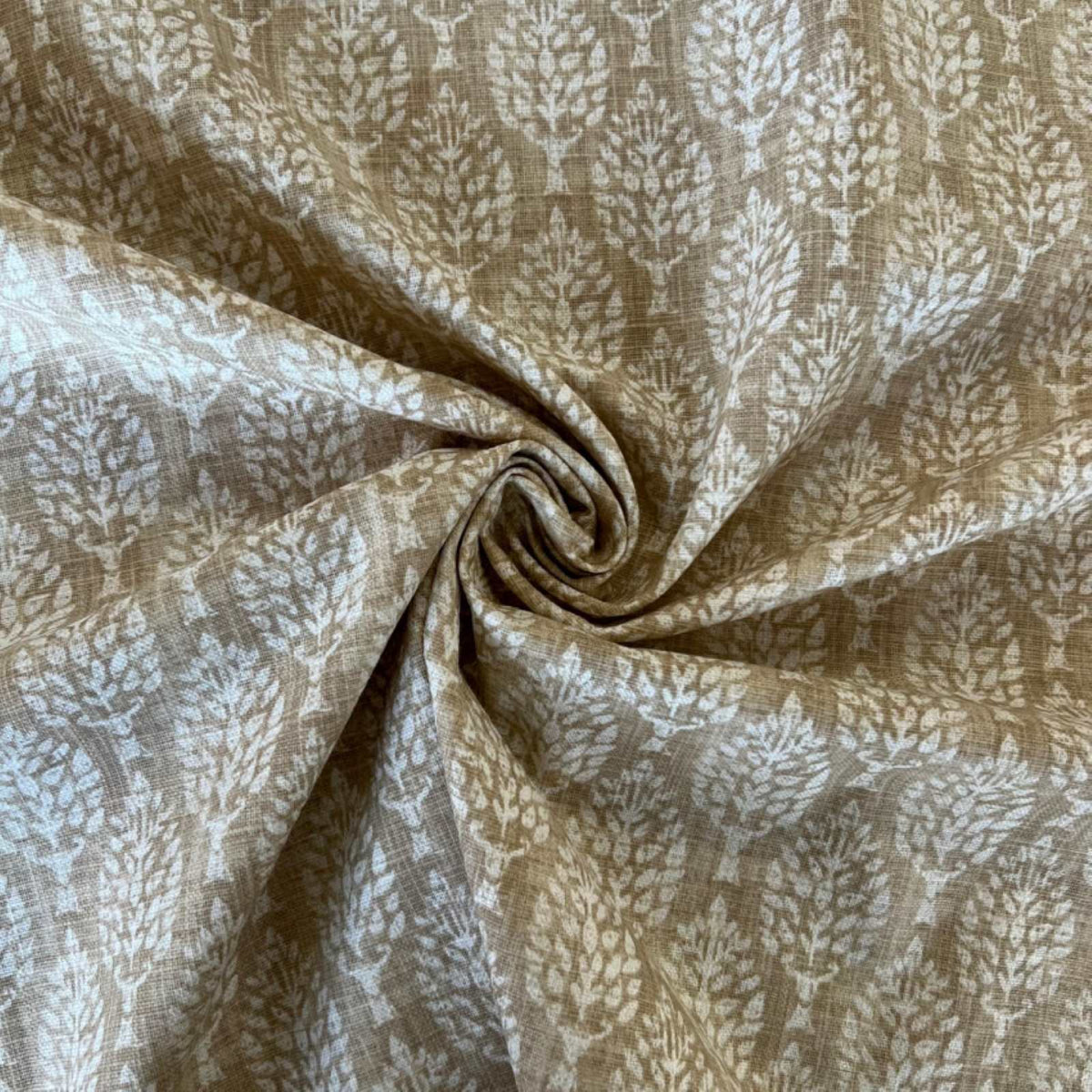Leaf print fabric in maize with rule for scale