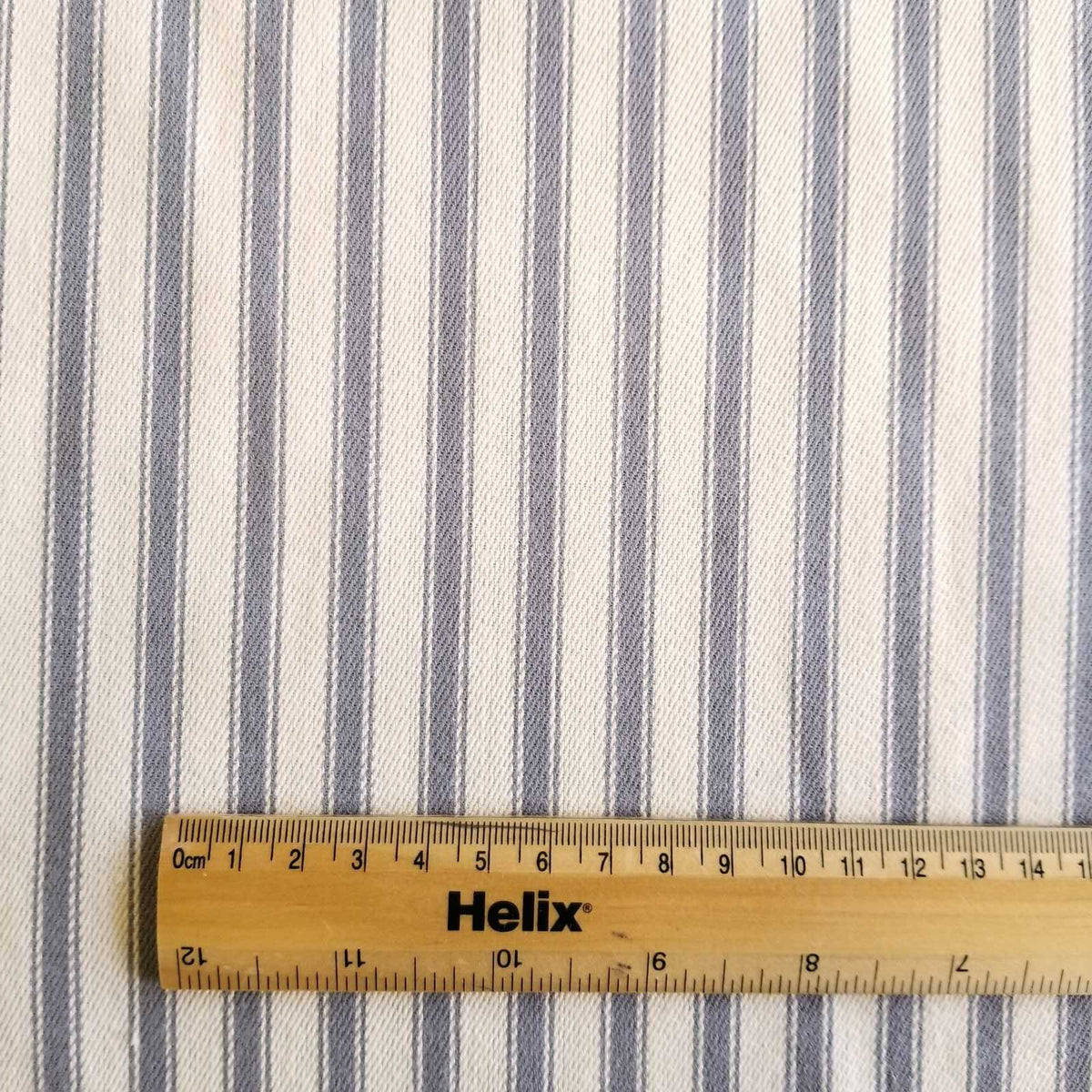 Soft Ticking Fabric with rule showing size of the grey stripes