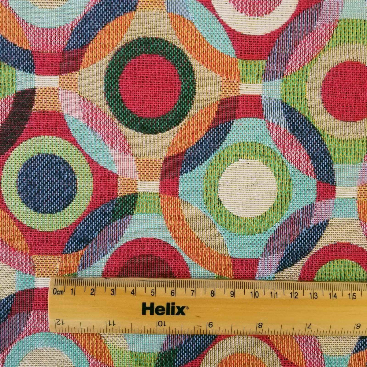 Multicolour tapestry fabric with a rule for scale of circles design