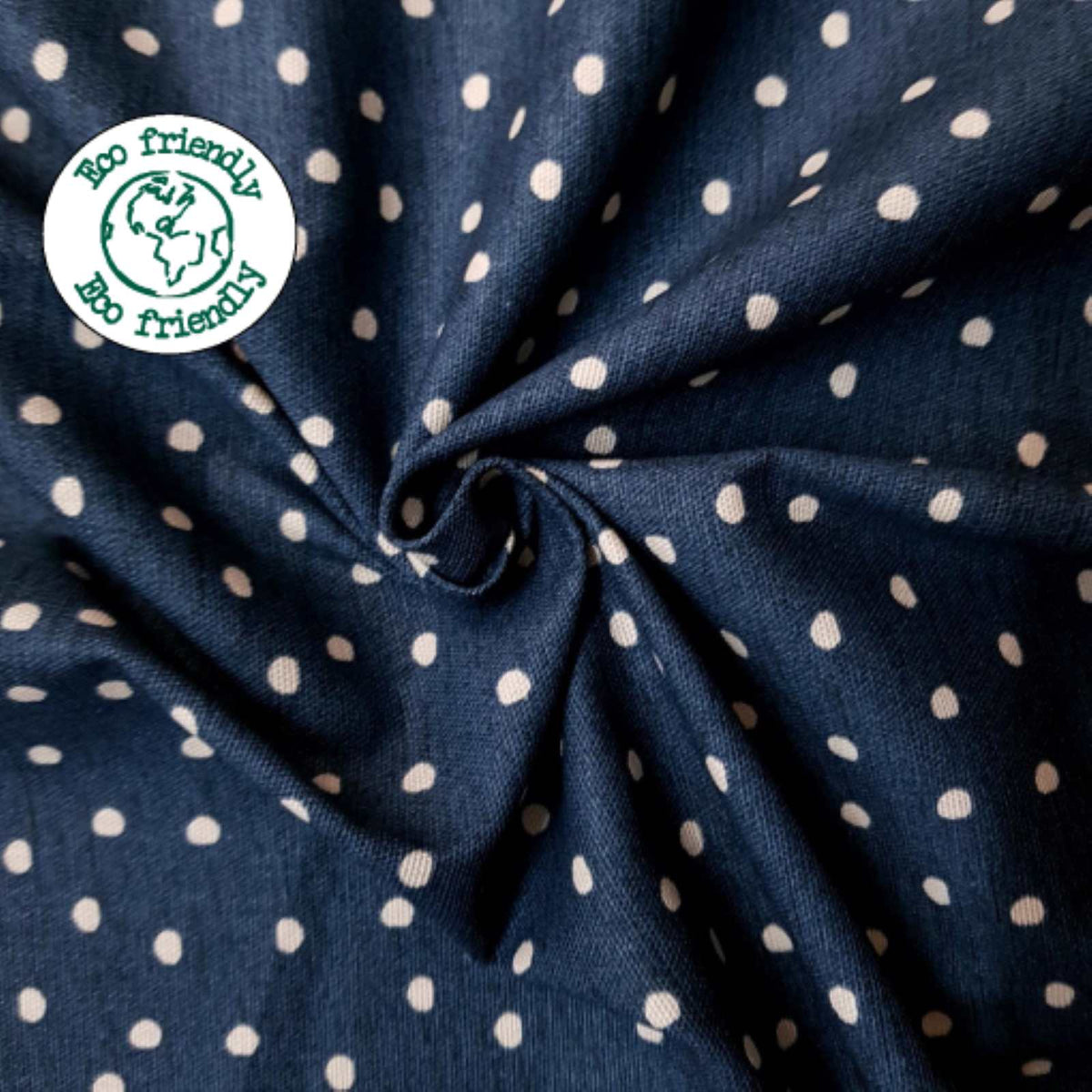 Eco friendly Cotton fabric with a spot design on a dark blue background