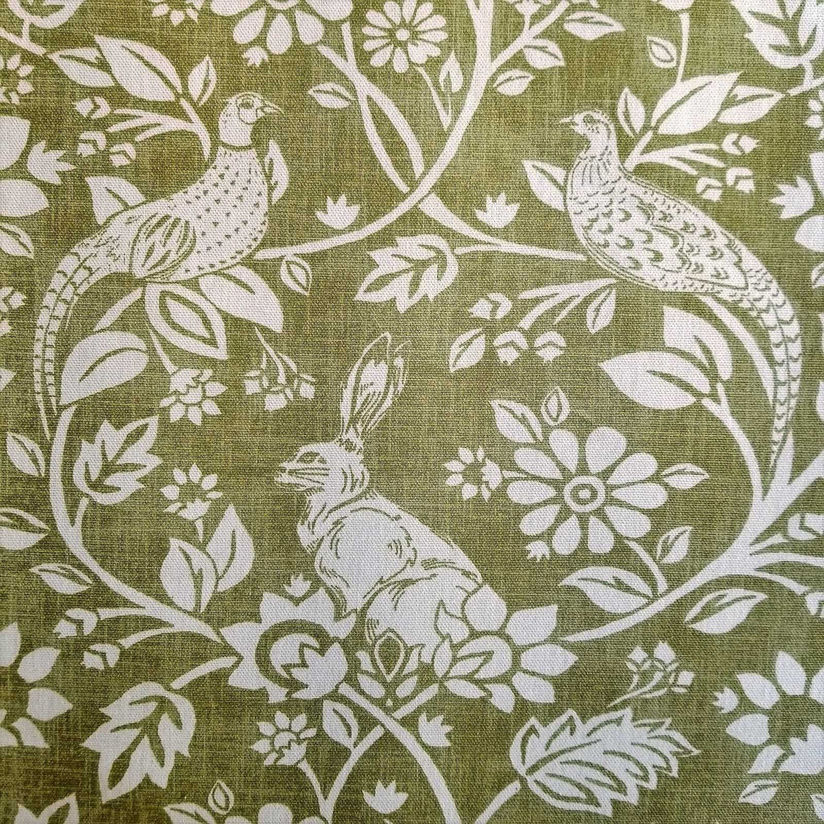 Hares and Pheasants design printed curtain fabric with a green background and cream design