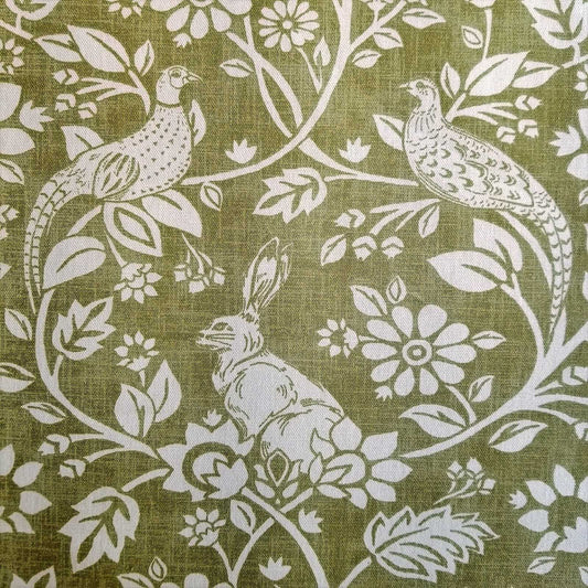 Hares and Pheasants design printed curtain fabric with a green background and cream design