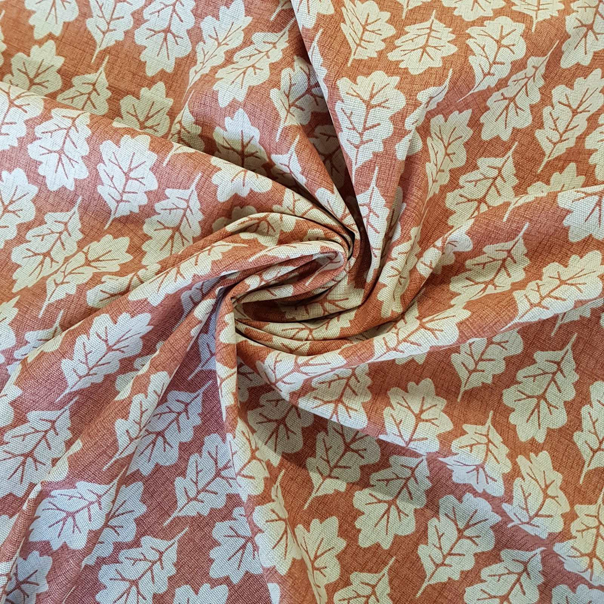 Terracotta curtain fabric with a leaf print