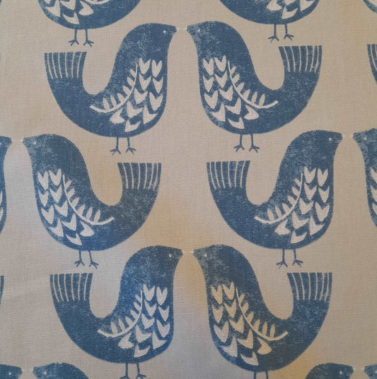 Curtain fabric with a scandi bird design in turquoise
