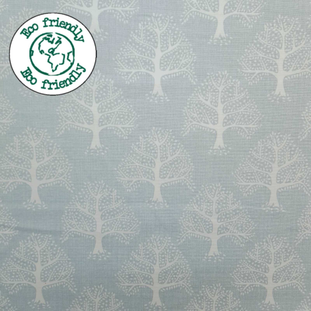Light Blue Fabric with a print of oak trees and and eco friendly badge