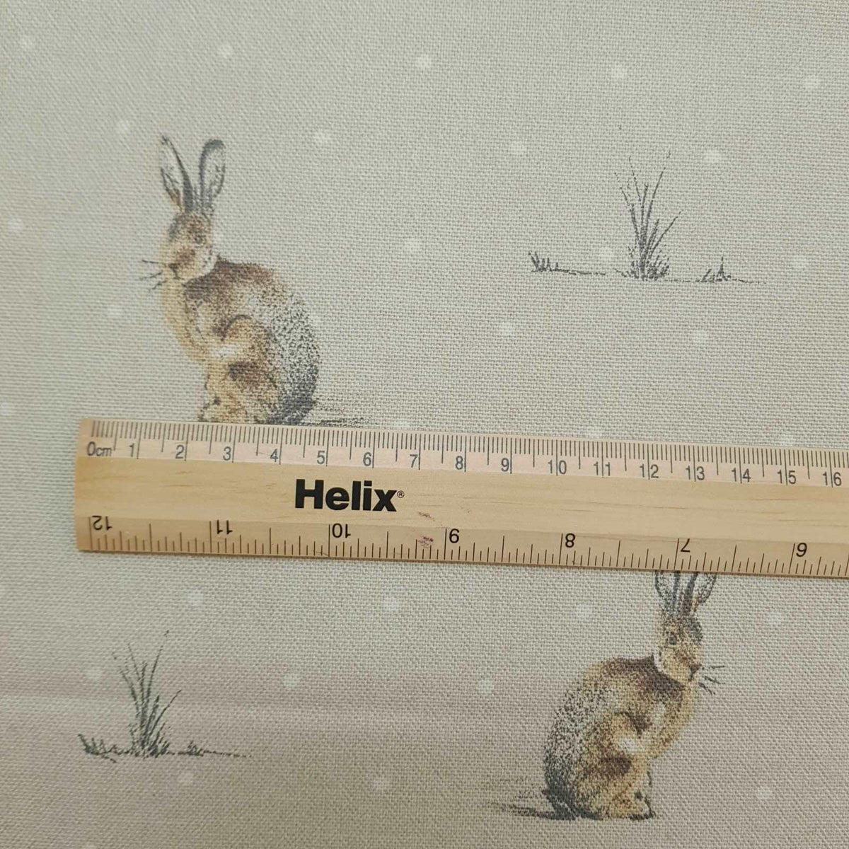 Curtain and blind fabric with a rule showing the size of the hare design print