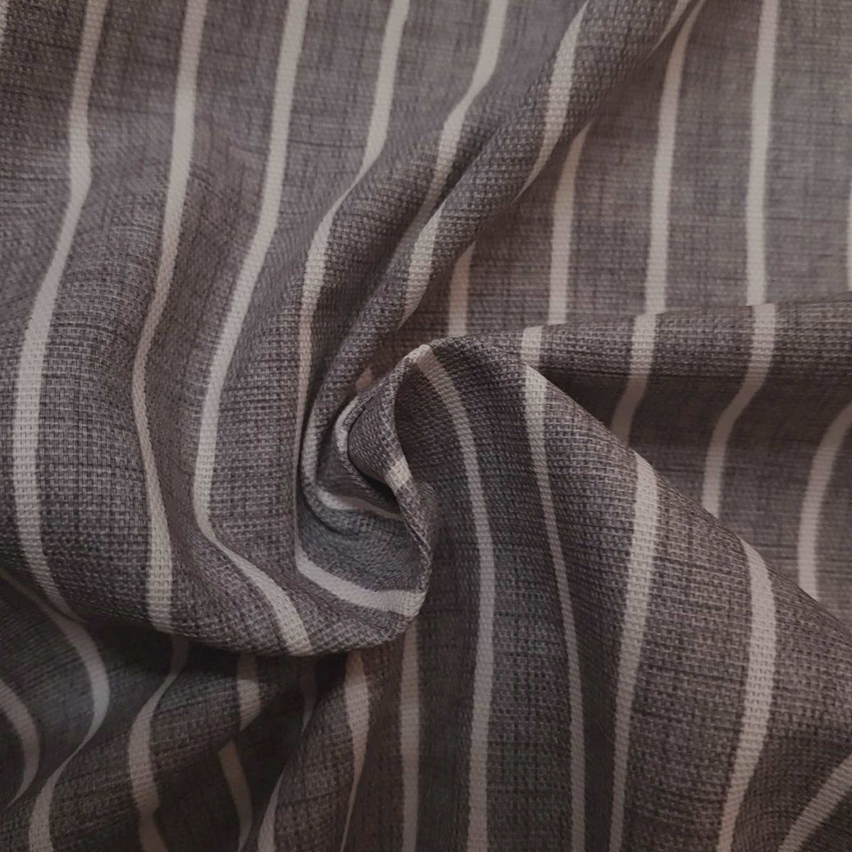 Eco friendly cotton curtain fabric with off white stripes on a grey background